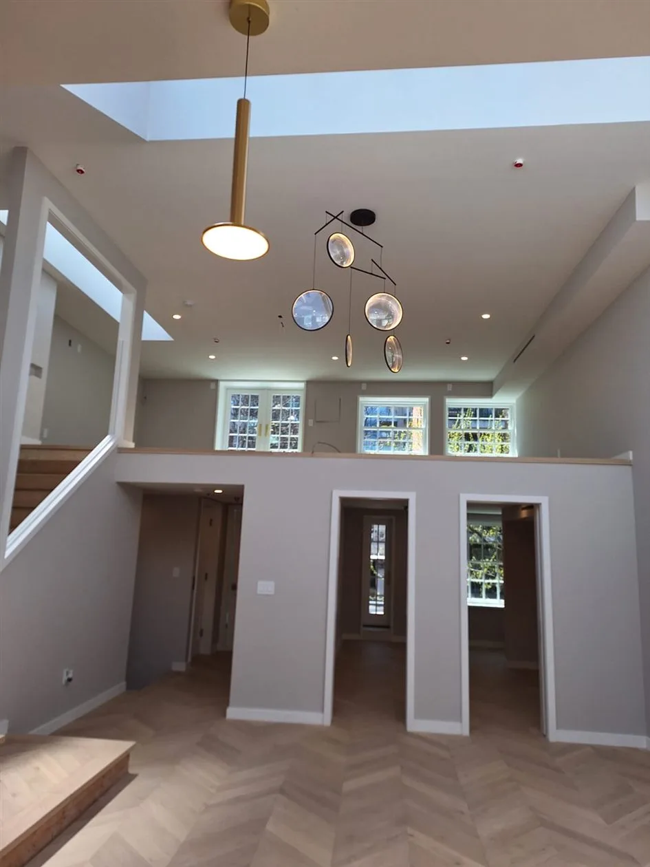 Finished ceiling in a Brooklyn private house wired by AE Electric, with recessed lighting, pendant fixtures and ceiling-mounted smoke detectors