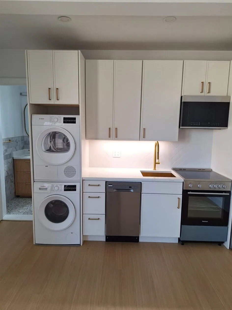 Renovated Brooklyn kitchen wired with separate appliance circuits and under-cabinet lighting by AE Electric