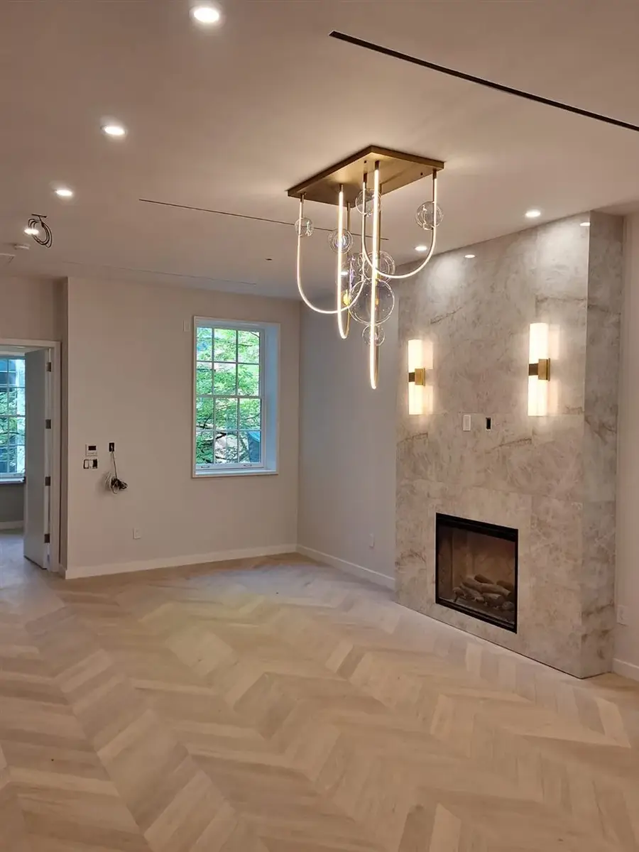 Complete electrical wiring and lighting installation in private Brooklyn house — chandelier, wall sconces, and recessed lighting by AE Electric