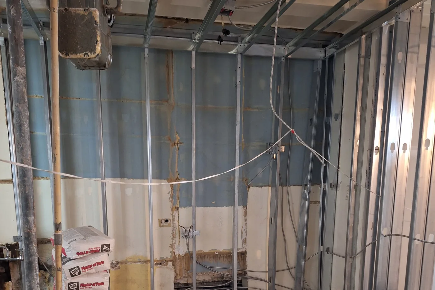 Apartment rewire in Astoria, Queens - new BX cable and junction boxes run through steel framing by AE Electric